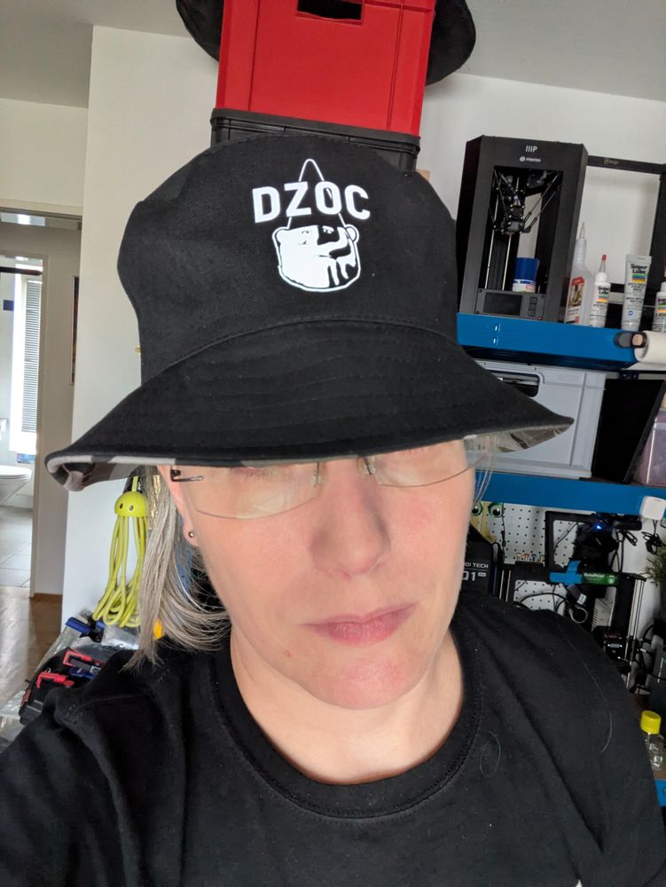 A black bucket hat on my head, with a data gnome logo and the text "DZOC" on it.