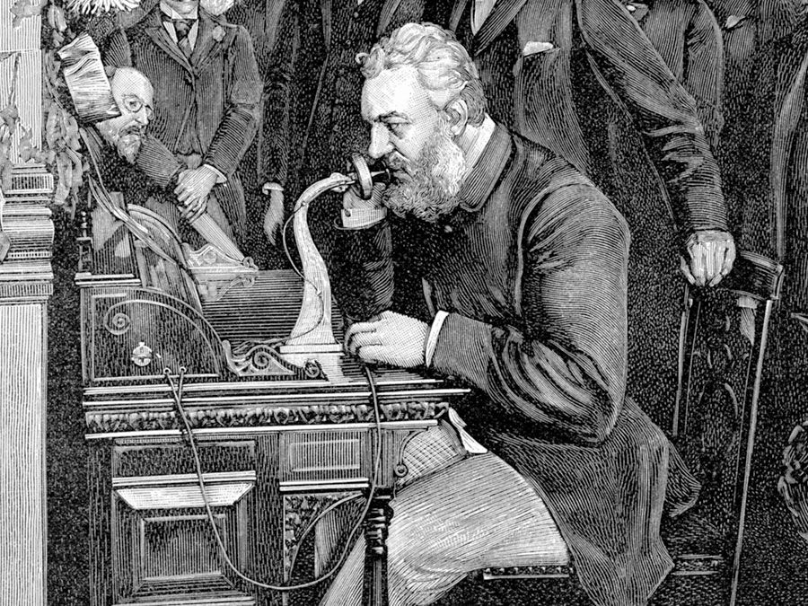 An illustration of Alexander Graham Bell demonstrating the telephone
