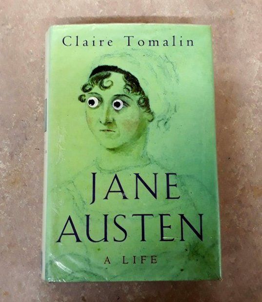 The biography Jane Austen A Life by Claire Tomalin. Googly eyes have been added to the cover.