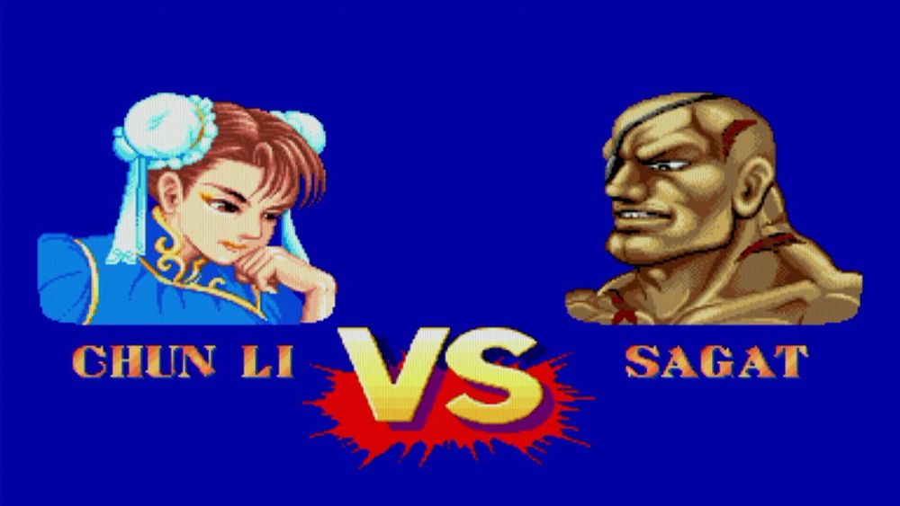 A screenshot of Street Fighter 2, showing the versus screen with Chun Li on the left and Sagat on the right with the big "vs" symbol in the middle.

The reading would just be "Chun Li versus Sagat"