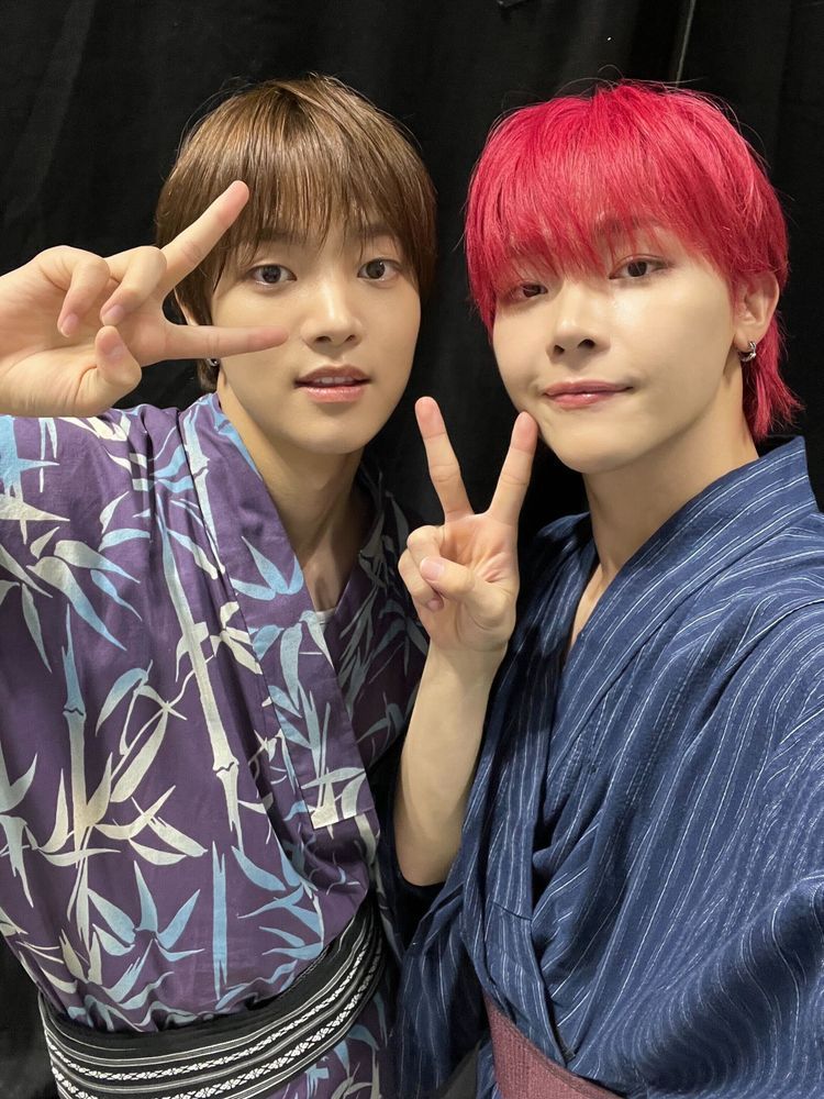 EJ and Nicholas selfie. Both are wearing kimono and making V signs. Nico's hair is bright red. 