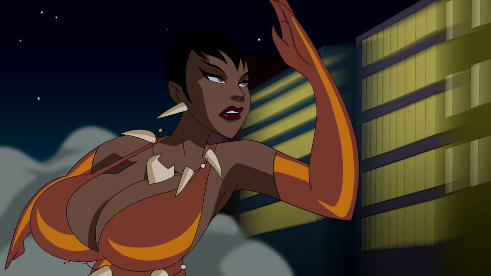 The edited screenshot shows Vixen running with an annoyed expression. Her magical necklace that normally grants her the power of various different animals without changing her form has malfunctioned and given her body a pair of very distinctively mammalian blessings. Now her huge breasts strain both the taut straps of her costume and her patience.