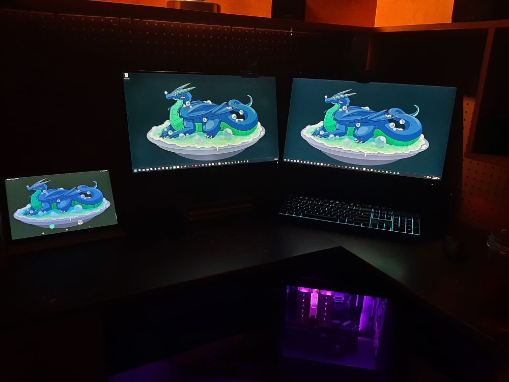 New look of my desk. We took down the left shelving to have more monitor space. My second monitor was above my main one (far right). So now doing tasks and streaming will be MUCH easier. Also got my drawing tablet (far left) to match the monitors.