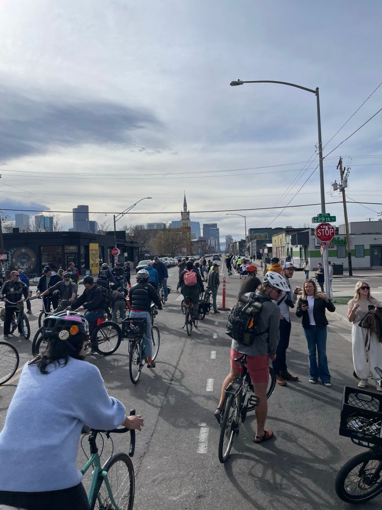 20-30 cyclists riding down Larimer st in protest of the reopening to vehicles 
