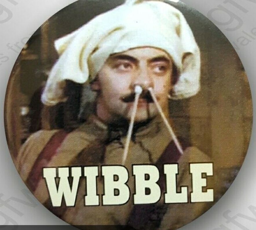 An image of Rowan Atkinson as Capt Blackwater from Blackwater goes Forth with two sticks up his nose and a pair of underpants on his had saying wibble