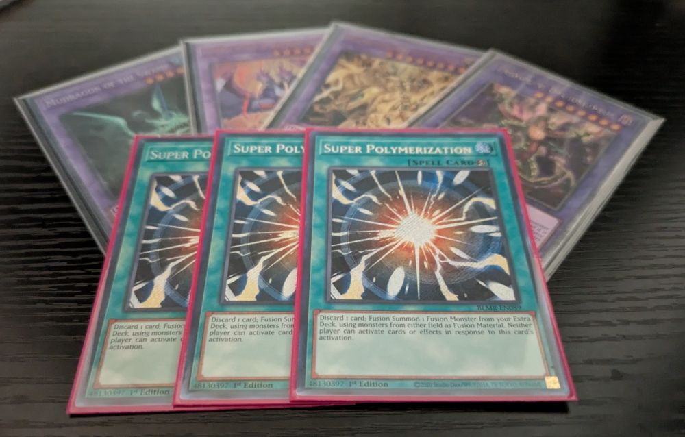 Three copies of Super Polymerization on top of 4 Super Poly targets (Mudragon, Garura, Secreterion Dragon, Dragostapelia). 