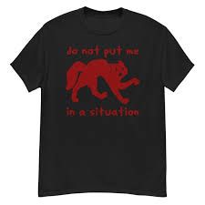 Black t-shirt with a red scared looking cat with the words "do not put me in a situation" written above and below the cat image. San Lang wears this in Chapter 20. 