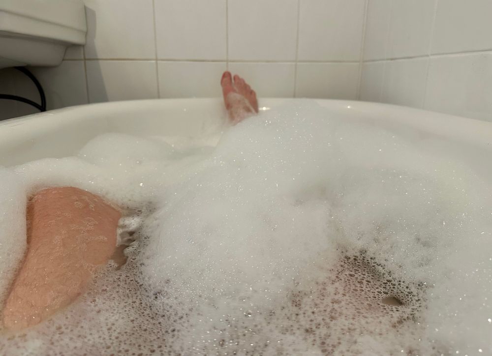 A shot of me legs in a nice bath with some strategically placed bubbles. 