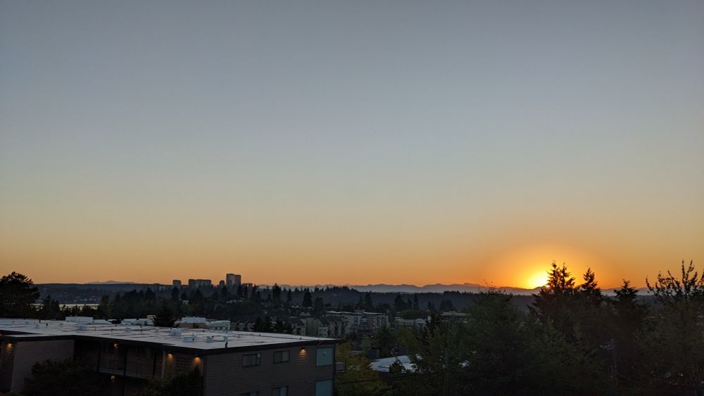 The sun coming up over the horizon. 