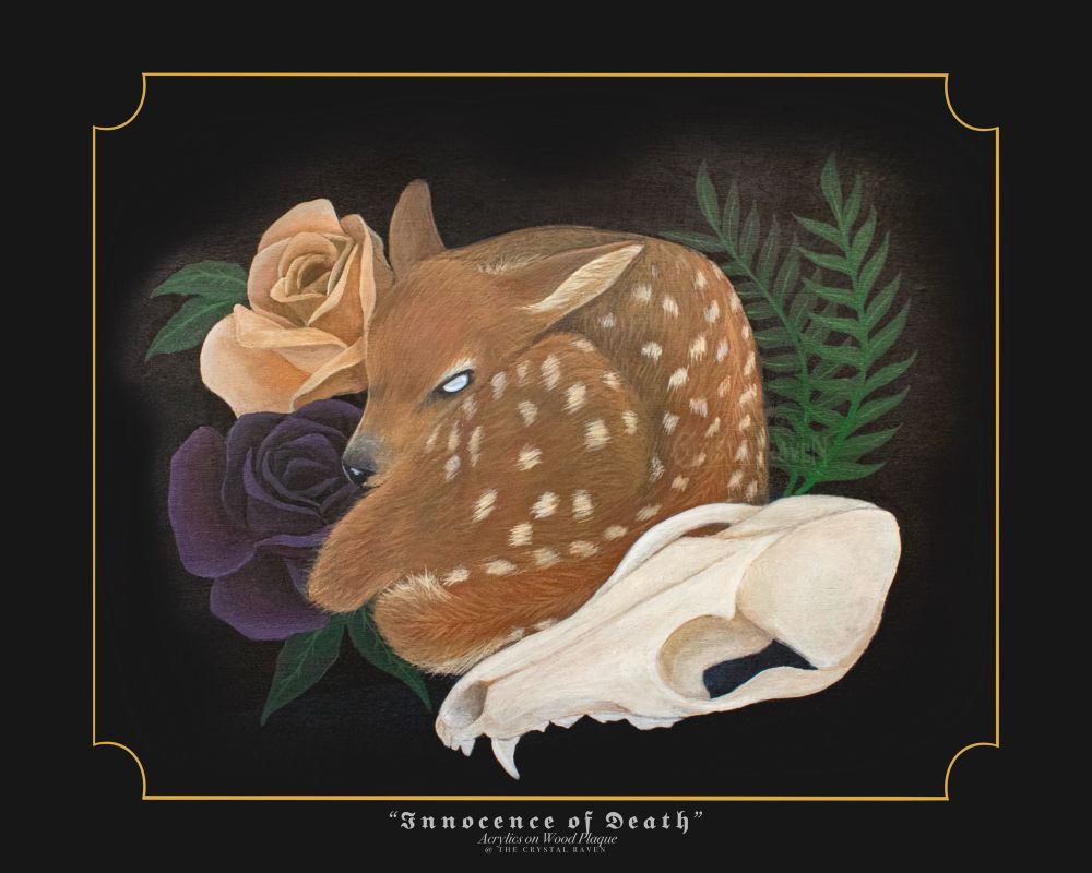 Painting on wood plaque of a deer fawn curled up with a coyote skull off to the lower right, a purple and a peach colored rose to the left of the fawn, and two fern leaves to the right. All on a black background with a thin gold pinstripe boarder. 