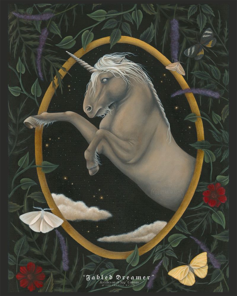 A painting on canvas depicting a cream colored unicorn with a white mane and fetlocks rearing inside a gold oval frame with a night sky of clouds and stars behind. Around the outside of the gold oval frame is a mix of green foliage, red and purple botanicals, and moths and butterflies. 