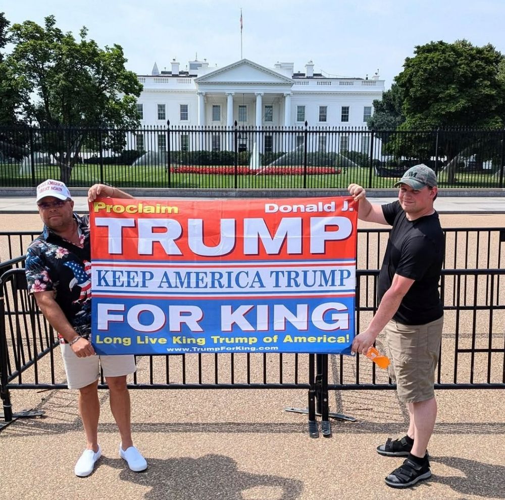 Picture of people holding large banner:

Proclaim
TRUMP
KEEP AMERICA TRUMP
FOR KING
Long Live King Trump of America!
www.TrumpForKing.com