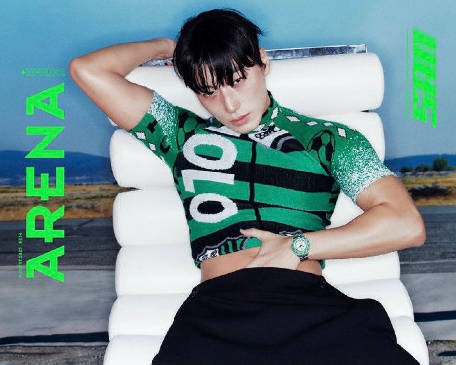 san for arena magazine. sitting on a chair with his 