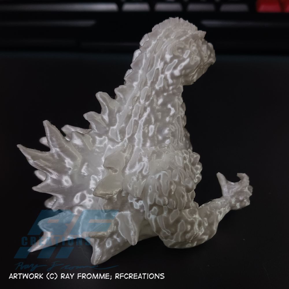 A 3D printed bust of Godzilla.