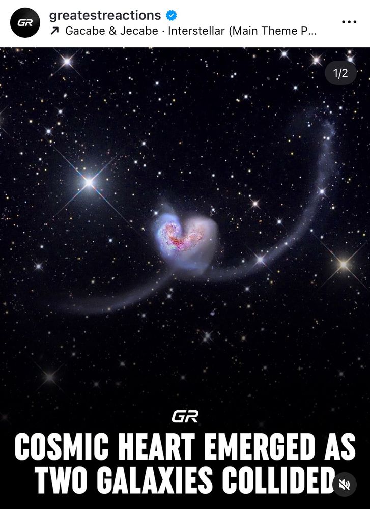 A screenshot from instagram of a galaxy heart shape with the caption « cosmic heart emerges as two galaxies collide »