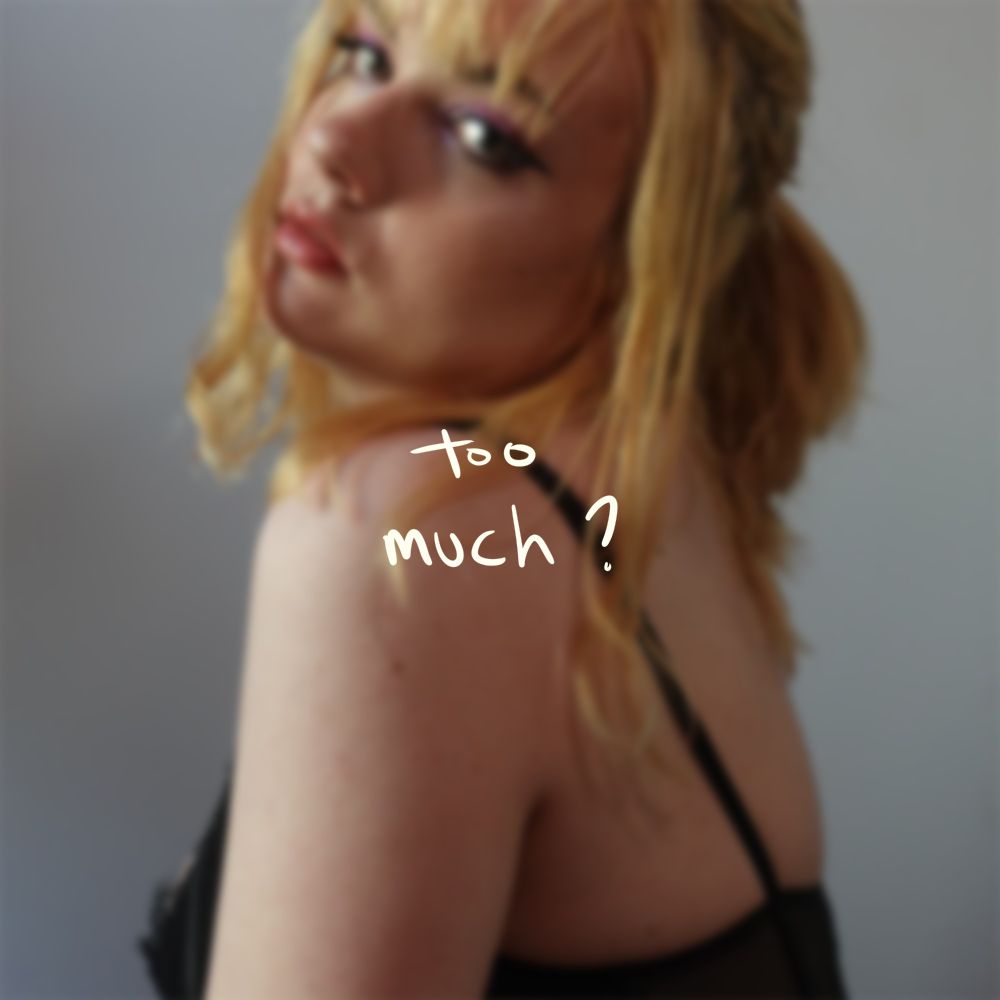 Album art: blurry pic of syd looking at the camera with handwritten text "too much ?" centered over it