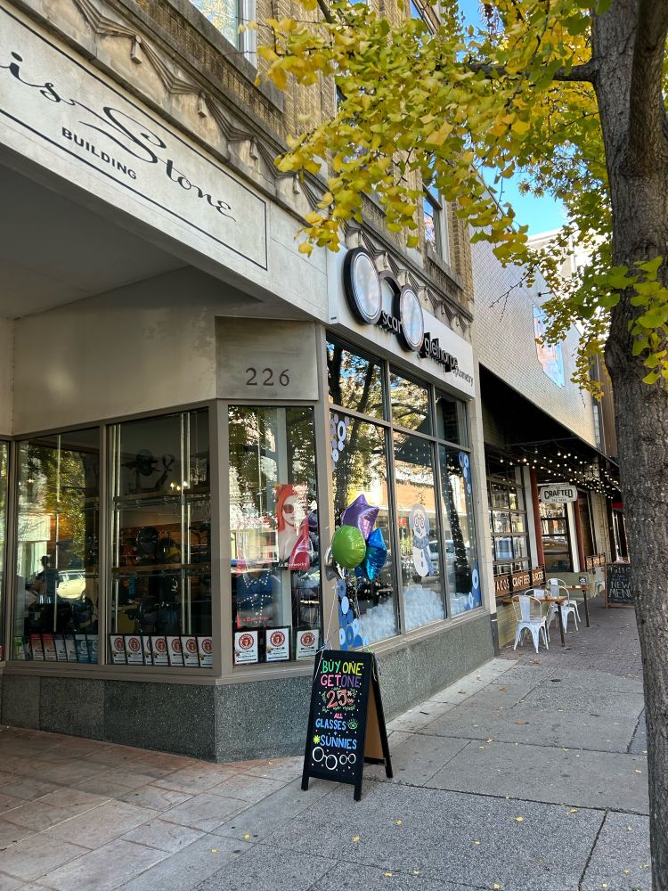 The Oscar Oglethorpe storefront in Greensboro. A sign is out front advertising their sale. 