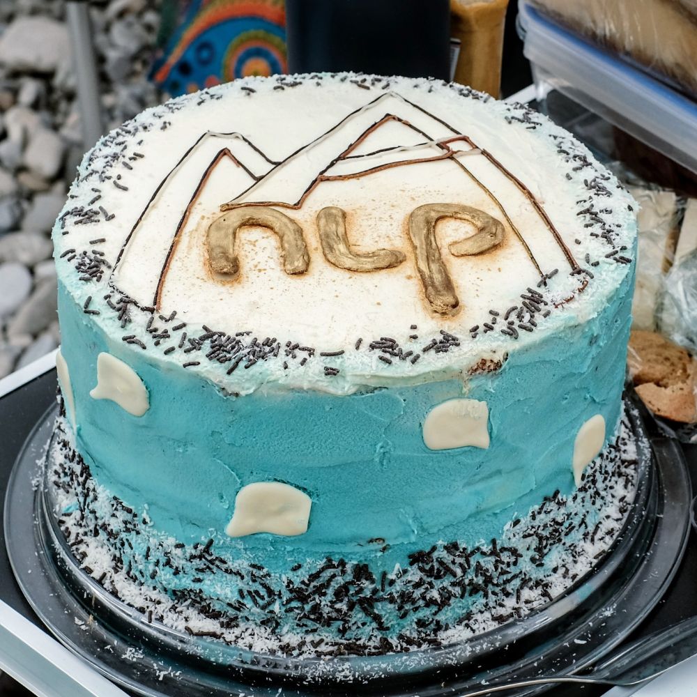 the MaiNLP birthday cake with our logo on top
