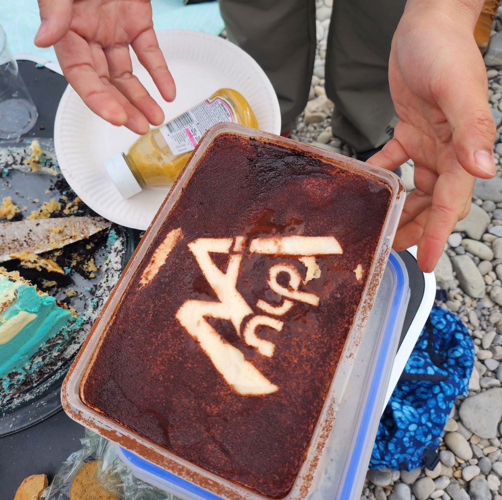 a Tiramisu with our logo carved into the cocoa powder on top