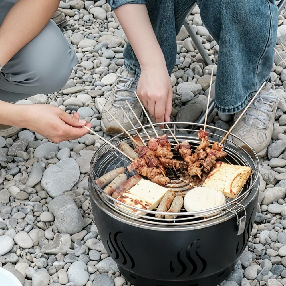 a barbecue with grill cheese and skewers