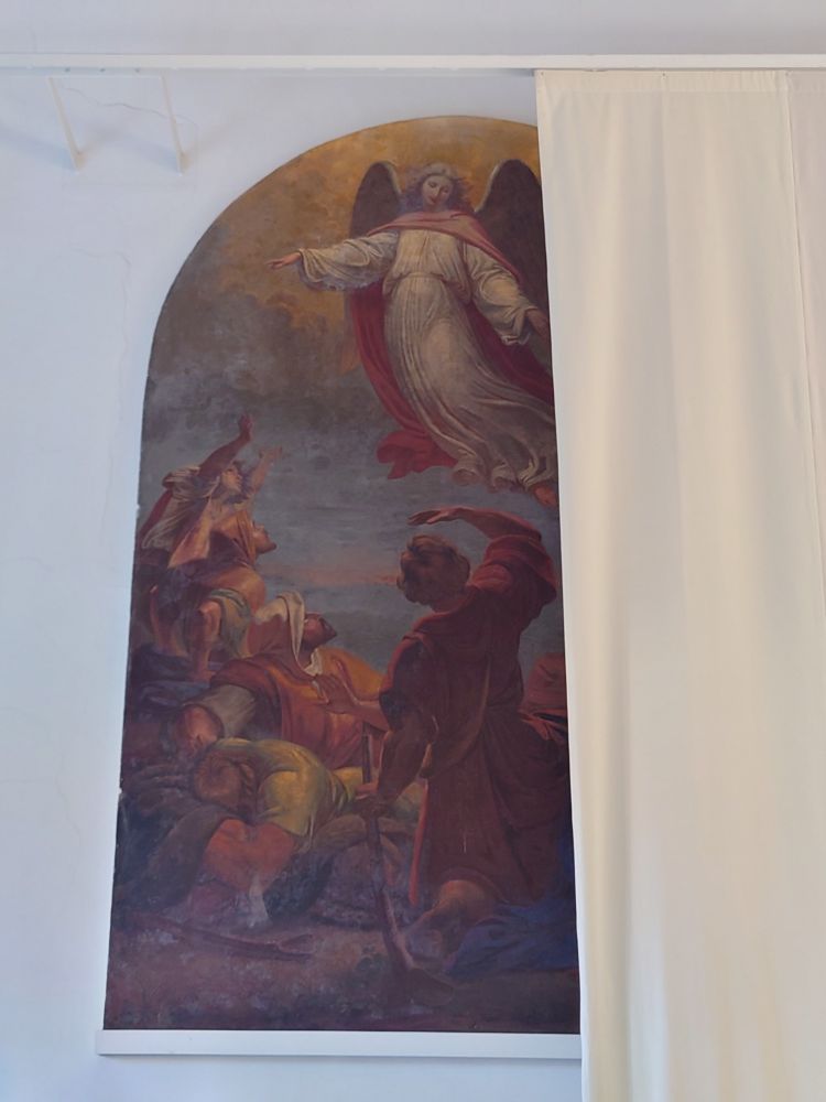 Wall fresco of an angel appearing to the shepherds from the Christian nativity story. 