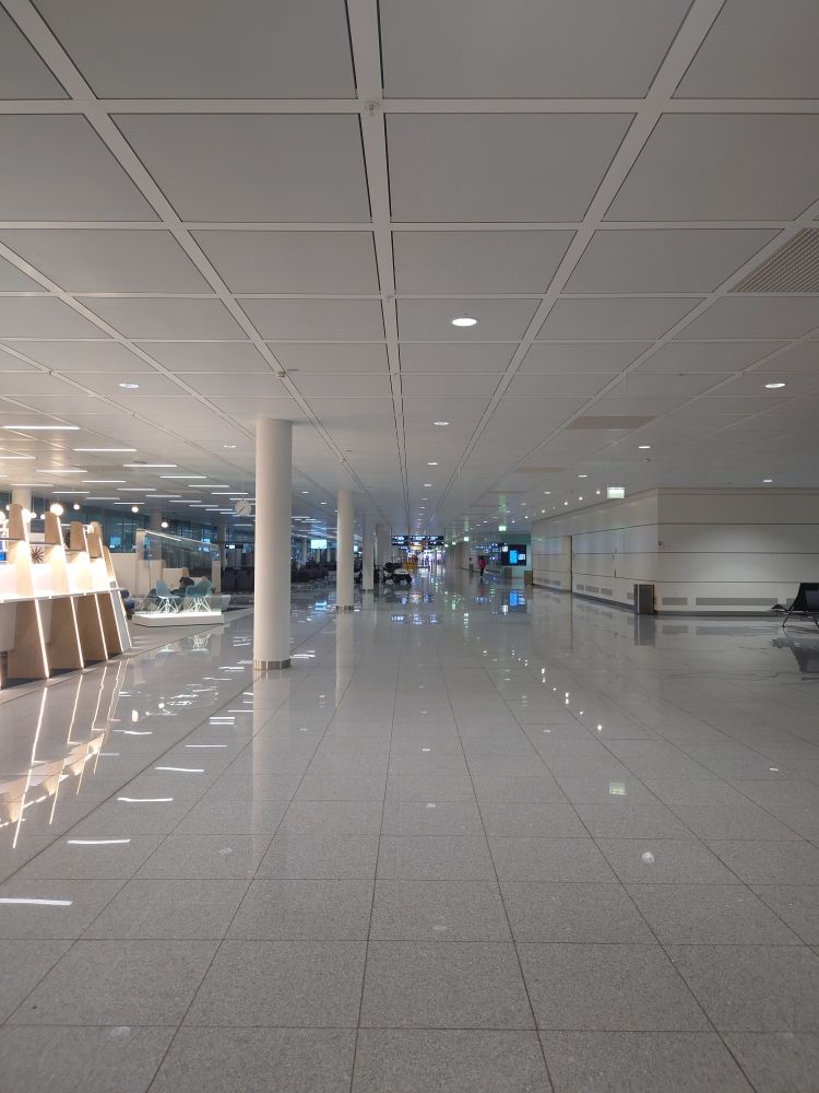 View down a deserted terminal in Munich airport.
