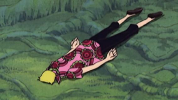 A screenshot of sanji from one piece lying face down on the ground with his arms by his sides