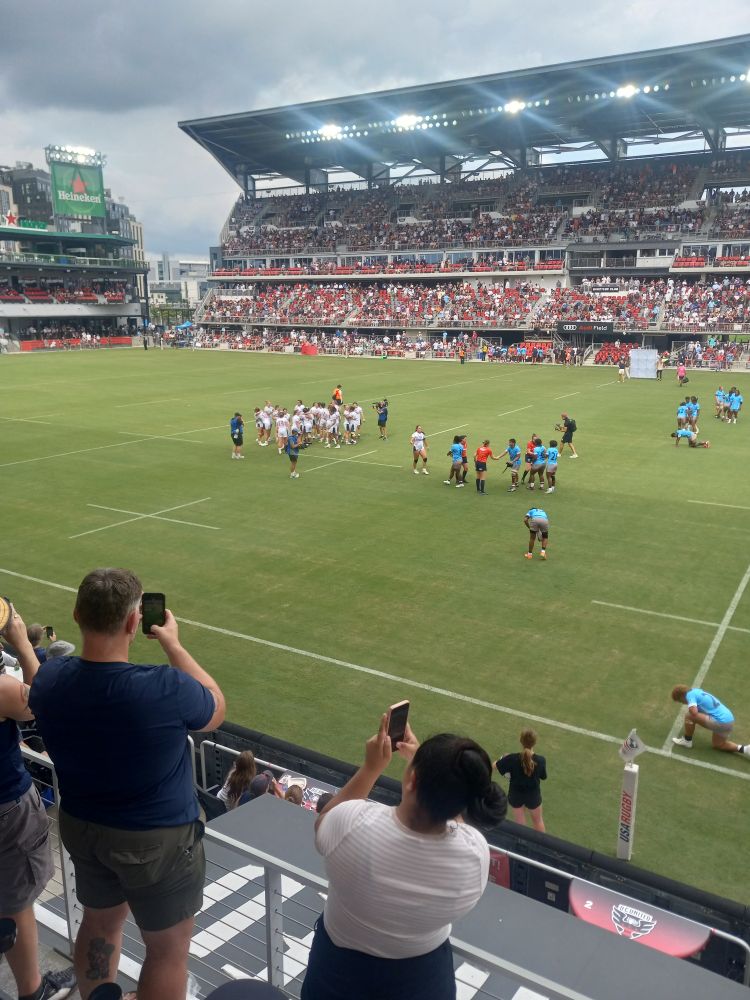 USA and Fiji women's rugby teams post-game 