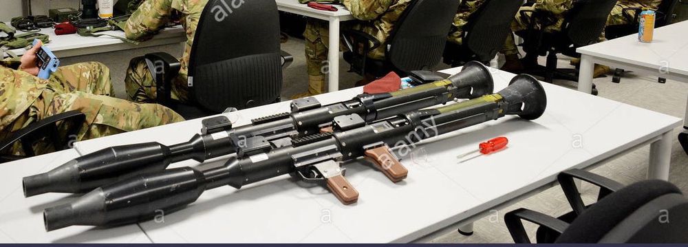 Two rocket propelled grenade launchers on a table
