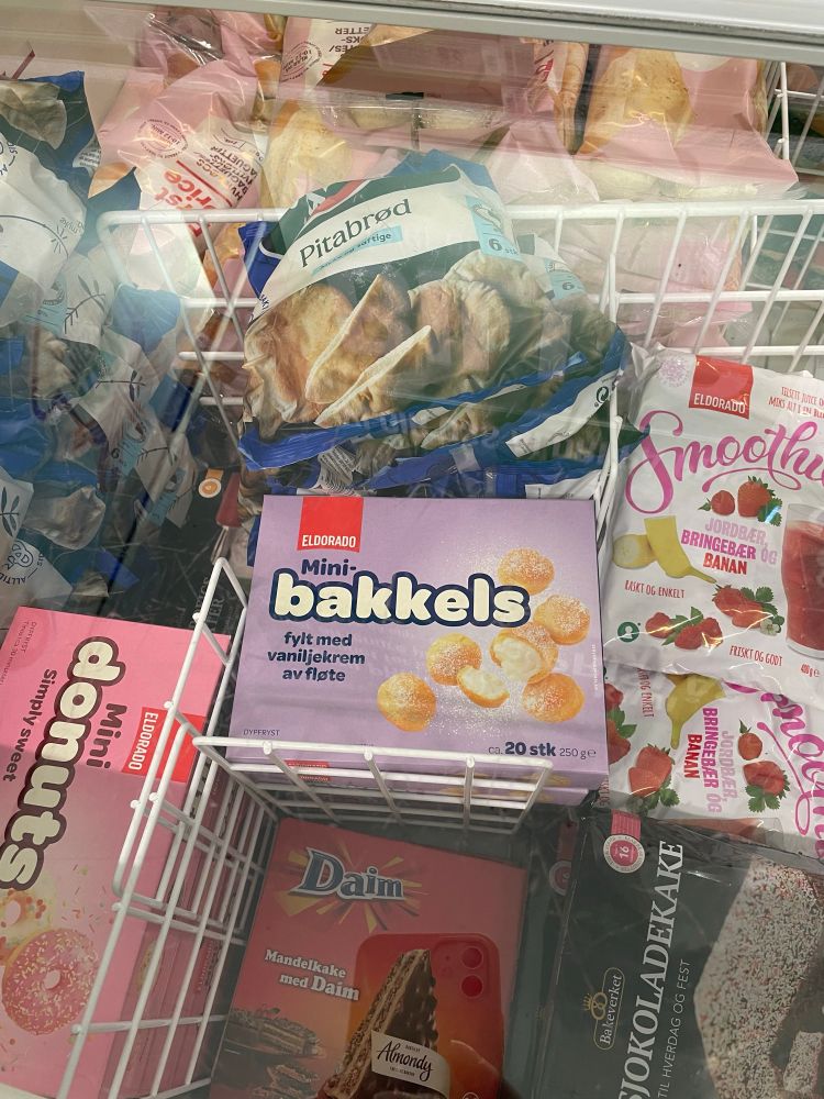a supermarket freezer containing a number of items, including a box of “mini-bakkels”