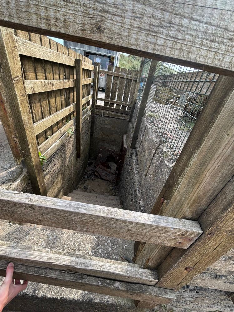 The steps down from the patio of Harry’s Shack into the pillbox at the east end of Portstewart Strand. The pile of rust at the bottom of the steps is the remains of the door. 