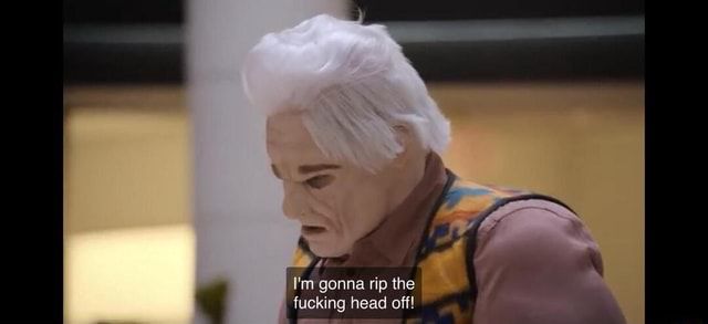 Screenshot from ITSYL of Tim in all the makeup for the prank show sketch with the caption “im gonna rip the fucking head off”