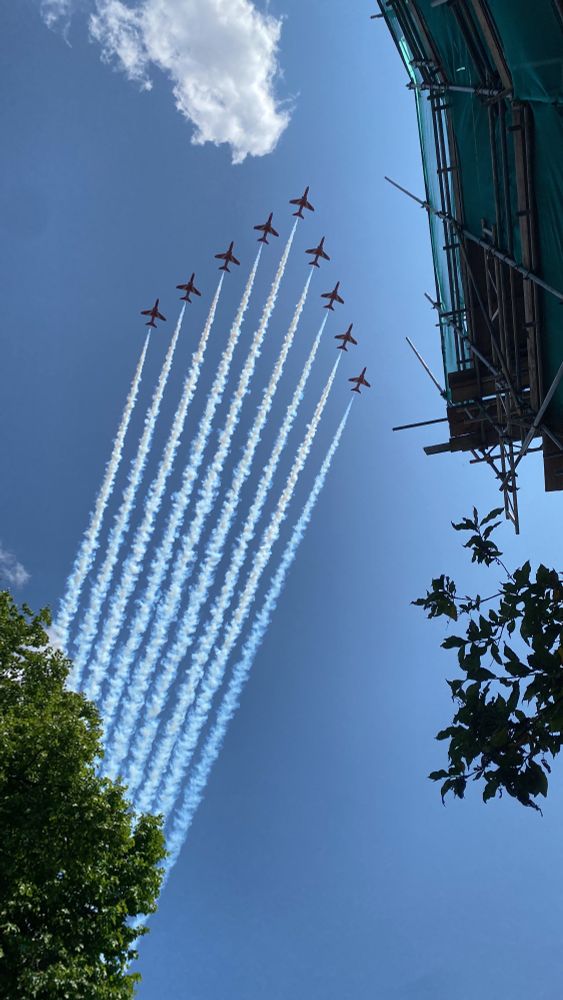 Red arrows fly over a London residential street 