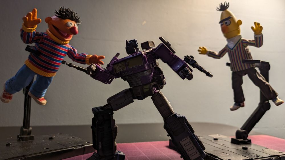 Toys: Bert and Ernie attacking Shattered Glass Optimus Prime 