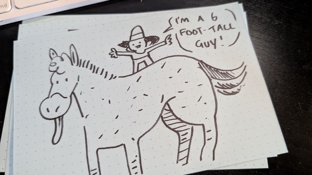 A horse with a little dude on the back 