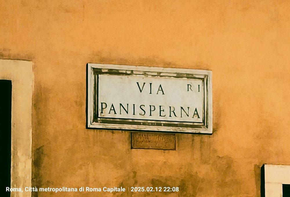 Sign of "Via Panisperna" on the wall of a building