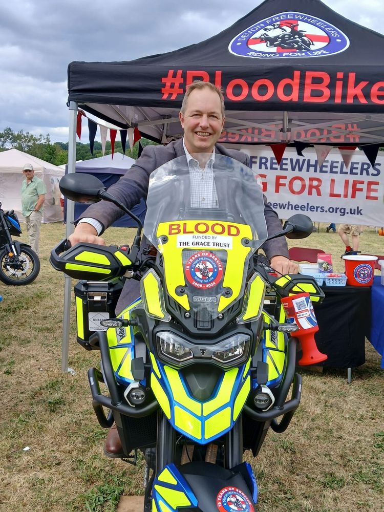 A photo of Richard Foord on a motorbike in the livery of the Devon Freewheelers blood bikes