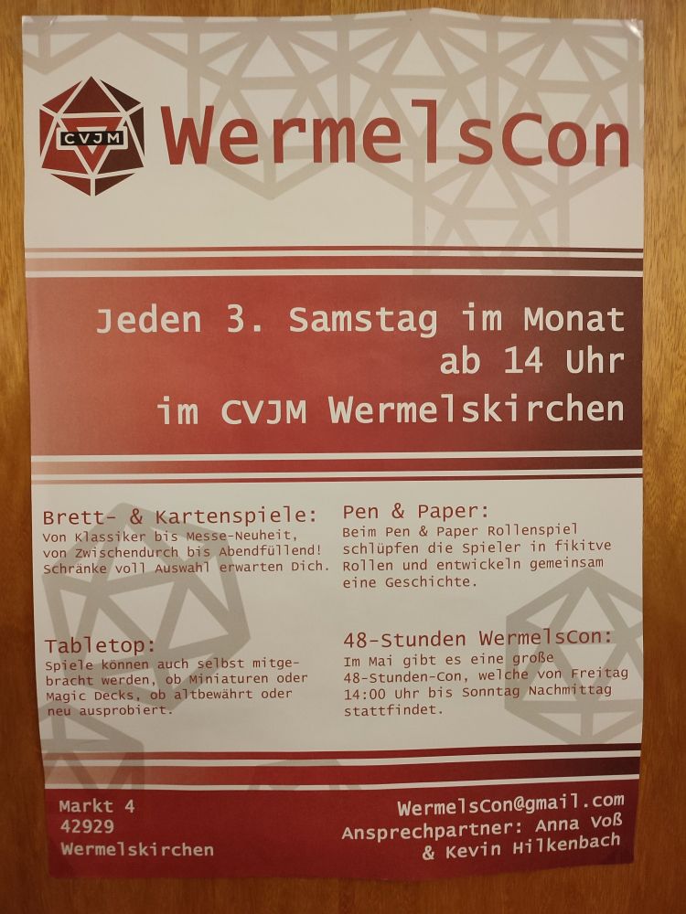 Rot-weißes Plakat der WermelsCon: jeden 3 Samstag im Monat im CVJM Wermelskirchen , Brett- und Kartenspiel, Tabletop, Rollenspiele und eine große 48h Con im Mai. Mail Kontakt: Wermelscon@gmail.com