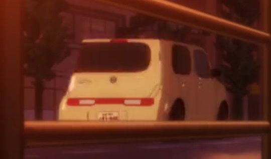 a low resolution screenshot of a 2D animated Nissan Cube vehicle as it drives by in the background of a scene. it's called the Cube because the back end is indeed shaped like a cube