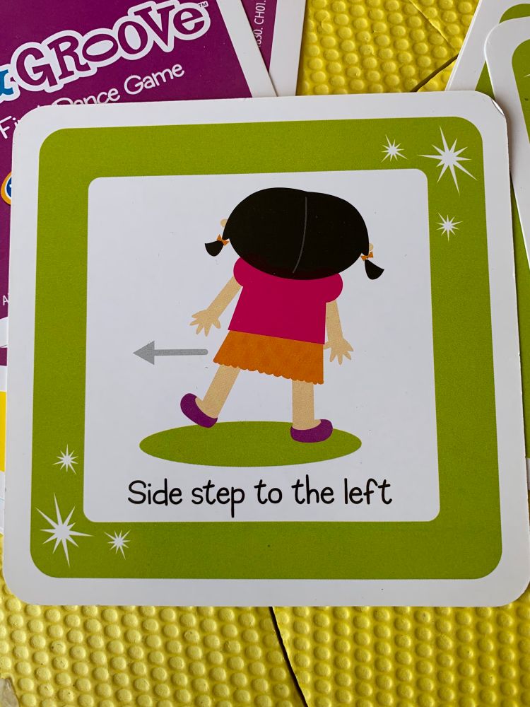 A card for a game with the caption “Side step to the left”, and a drawing demonstrating the same