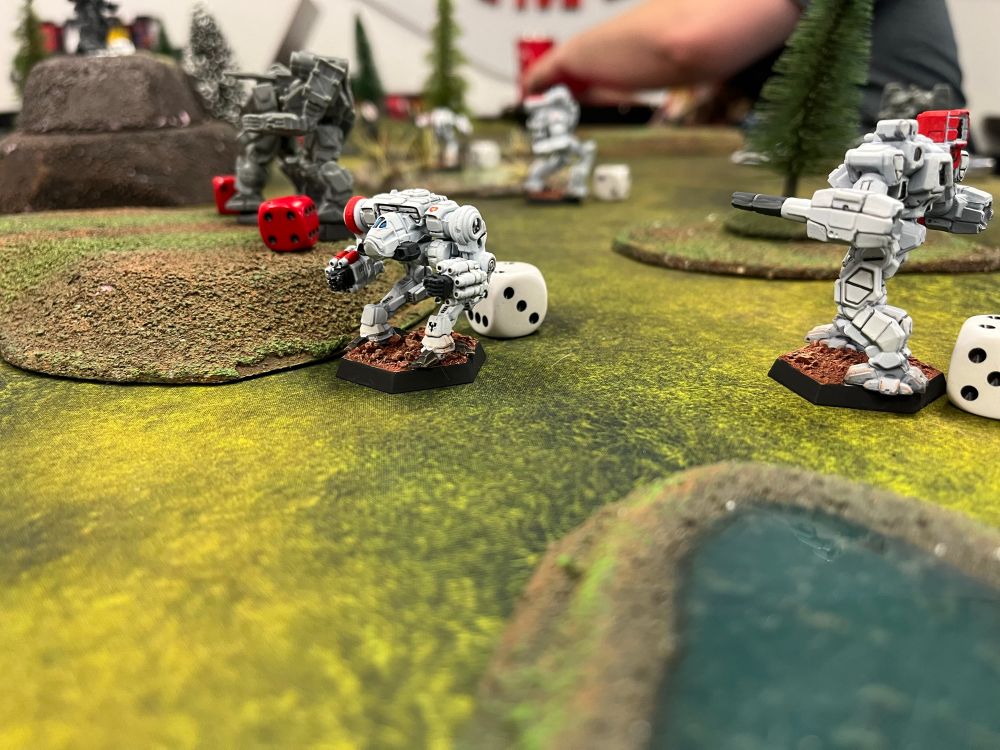 An AlphaStrike battlefield featuring Raven Alliance and Clan Ghost Bear mechs