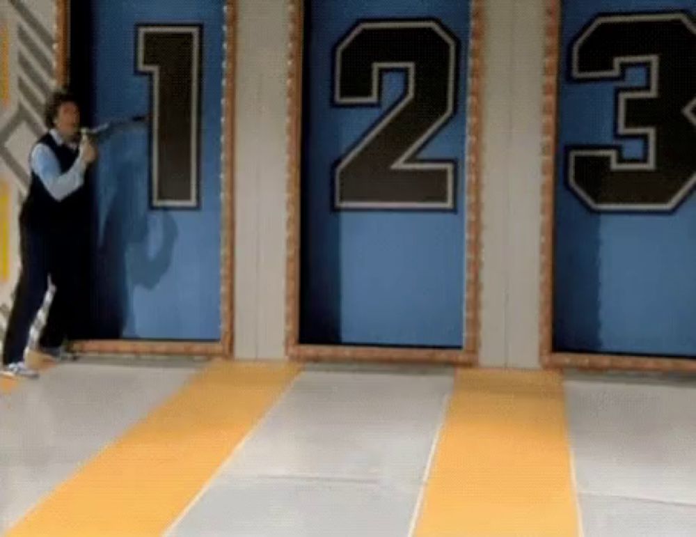 a man is standing in front of a wall with the numbers 123 on it