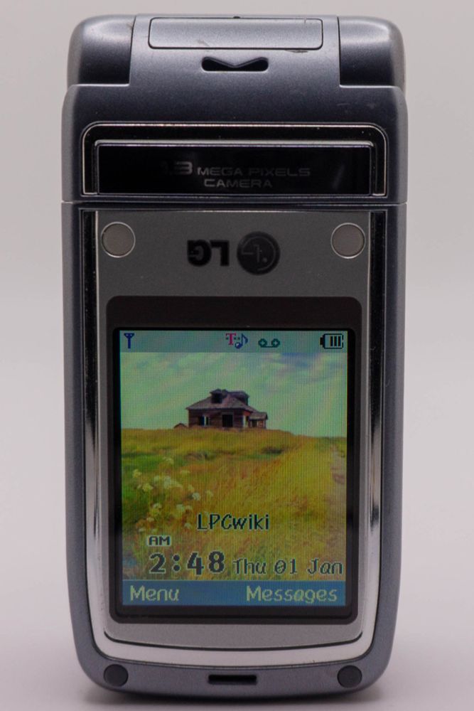 Another photo of the same LG L5100 as earlier, except this time the screen is swiveled 180 degrees to hide the keypad.
The phone is able to tell when this happens, and rotates the screen to compensate.