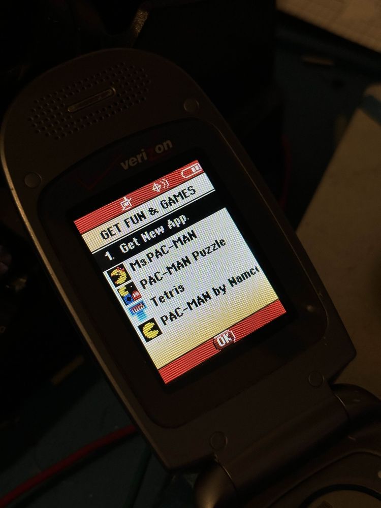 A photo of a Verizon Wireless-branded LG VX5300 on the "GET FUN & GAMES" screen, showing four apps that were sideloaded to the device. This was made possible by patching out the ESN and signature expiry date checks.
To those curious, the apps are:
- Ms. PAC-MAN
- PAC-MAN Puzzle
- Tetris
- PAC-MAN by Namco
