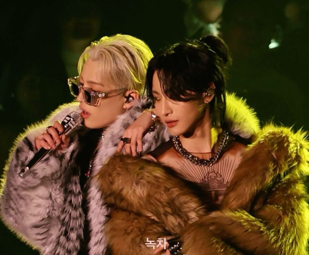 Hongjoong and Seongwha of Ateez. Both in fur coats and jewelry.