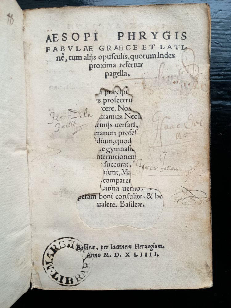 Title page of 16th century book with woodcut illustration cut out