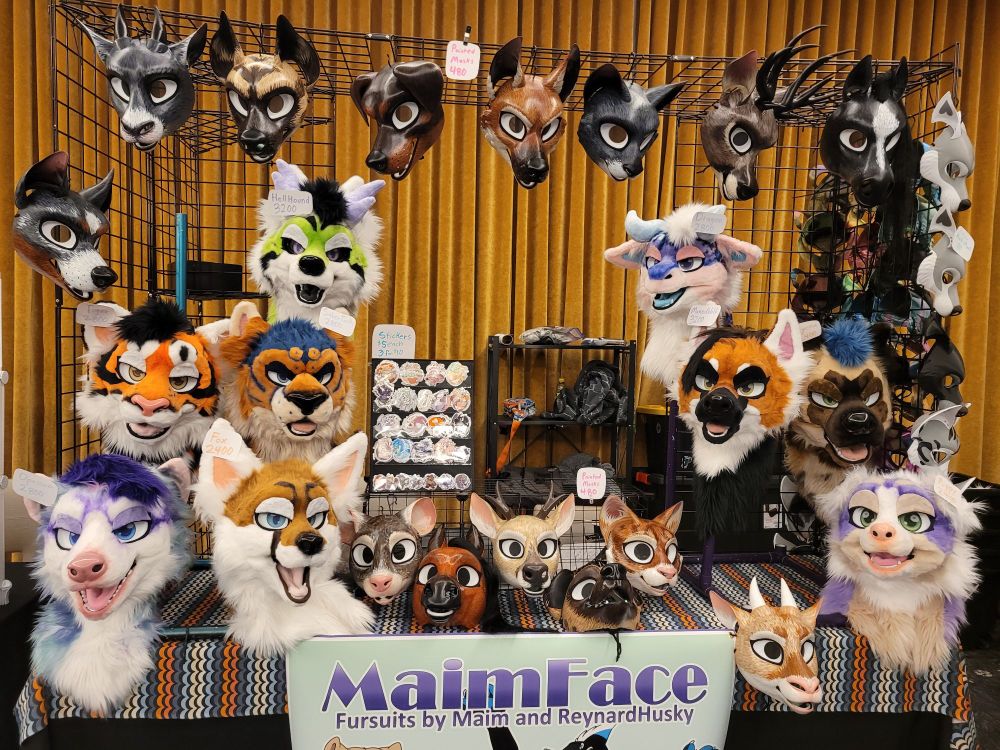Furry convention dealers table
Most of the space is taken up by fursuit heads and painted masks
