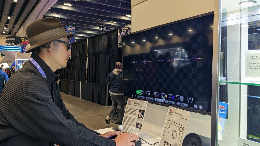 Baiyon playing Toshio Iwai and Maxis Games' SimTunes, with few dots and notes on screen.