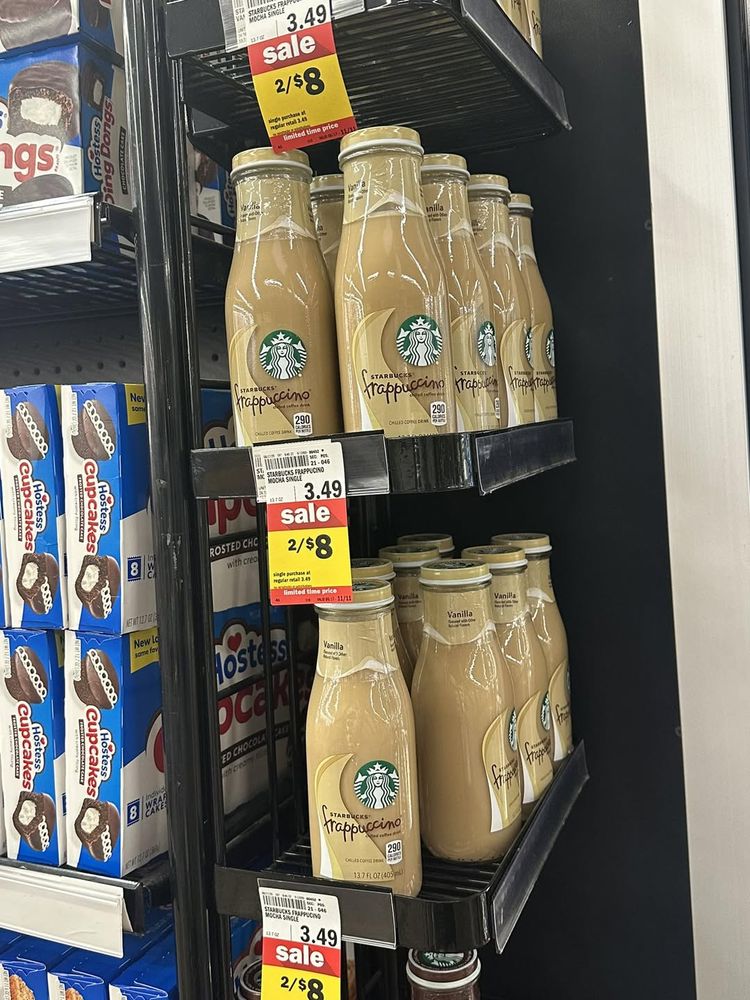 A picture of some Starbucks Frappuccino on a shelf, with the price clearly marked as $3.49 a bottle, but under that is a 'SALE' sign that says 