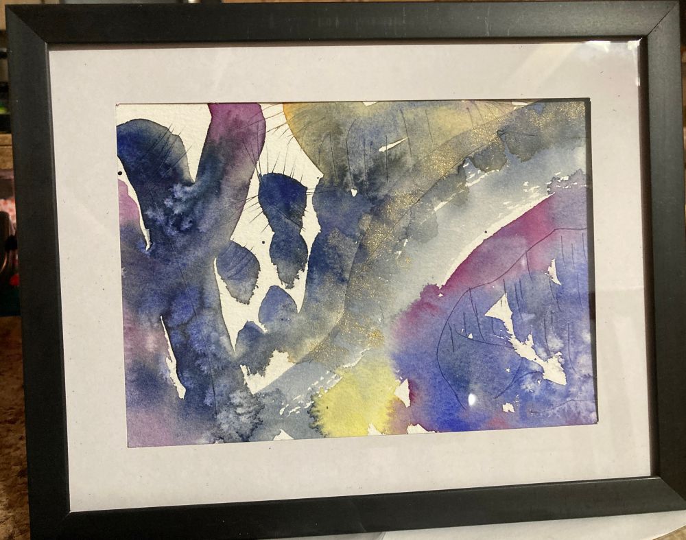 Abstract watercolor painting with blues, purples and yellow accents with some metallic gold in a matted black frame